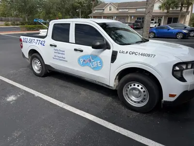 Blue vehicle graphic on a white truck Photo